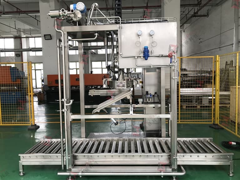 Aseptic bag-in-drum filling station with roller conveyor deck and utility panel for SIP steam sterilization