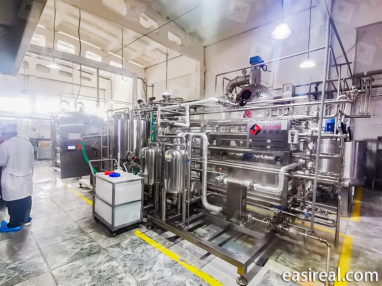 Tube-in-tube sterilizer line with product tank and sanitary piping for aseptic processing of fruit jam, fruit puree and juice
