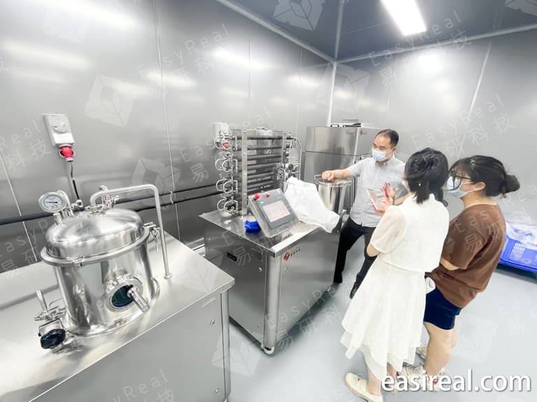EasyReal lab UHT HTST plant demonstration for A&W Food Service in China, showing pilot tubular sterilizer, control section, and fluid food R&D testing scene