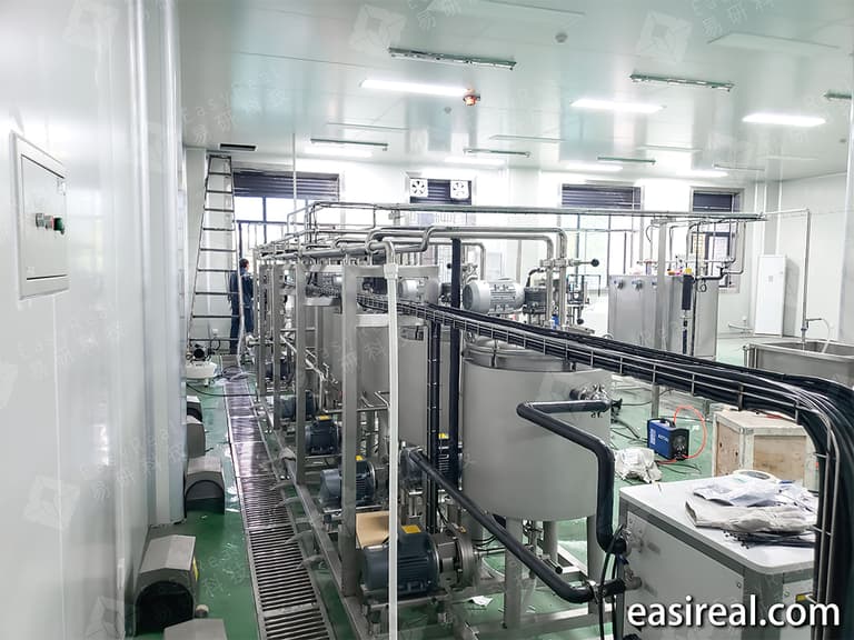 Installation view of the dairy and plant-based beverage pilot plant showing tanks, pumps, and pipeline layout