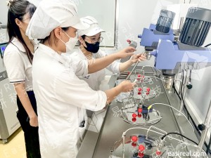 Close-up of INTERBOS operators setting up probes and lab mixers on EasyReal’s water bath fermentation pilot system.