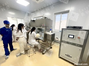 INTERBOS technicians working with an EasyReal pilot UHT/HTST system and aseptic filling cabinet in the Van Giang R&D laboratory in Vietnam