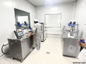 INTERBOS technicians operating twin EasyReal lab water bath mixing and fermentation systems inside a clean pilot plant room.